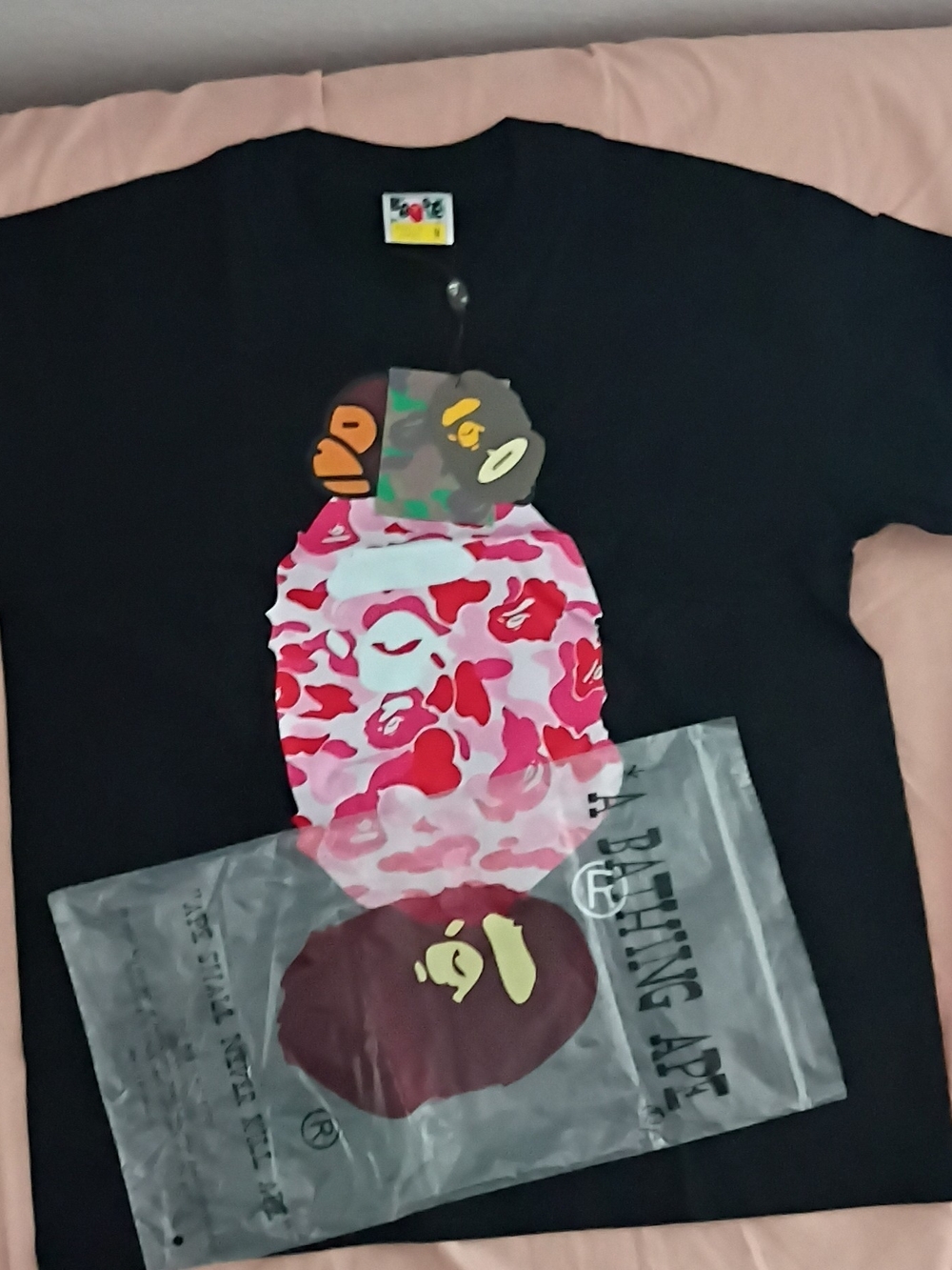 A Bathing Ape Short-Sleeve Tee in Black with Pink Camo Ape Graphic